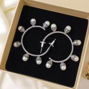 Most trendy pearl hoop earrings in oxidised silver finish for ethnic wear - attention-grabbing statement earrings